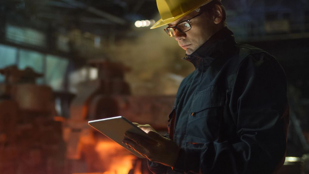 Engineer using tablet in foundry