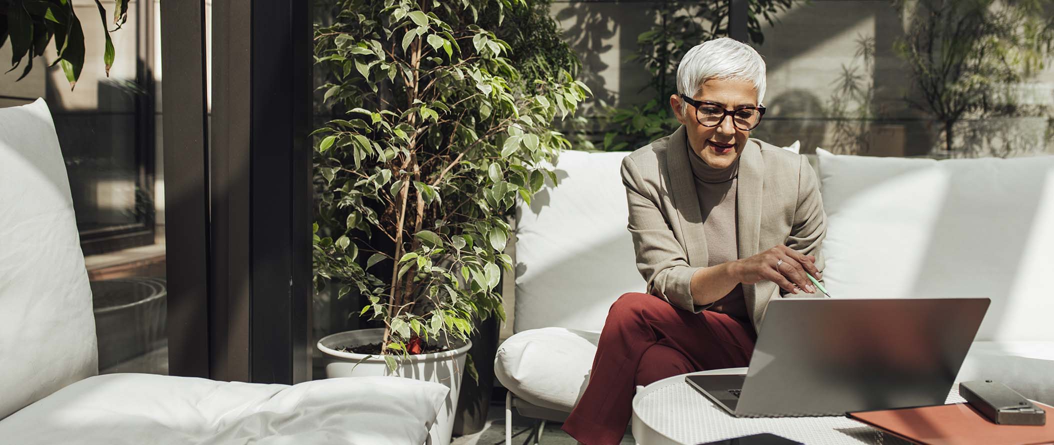 CORP-Senior-Businesswoman-Using-her-Laptop-at-Work-banner.jpg