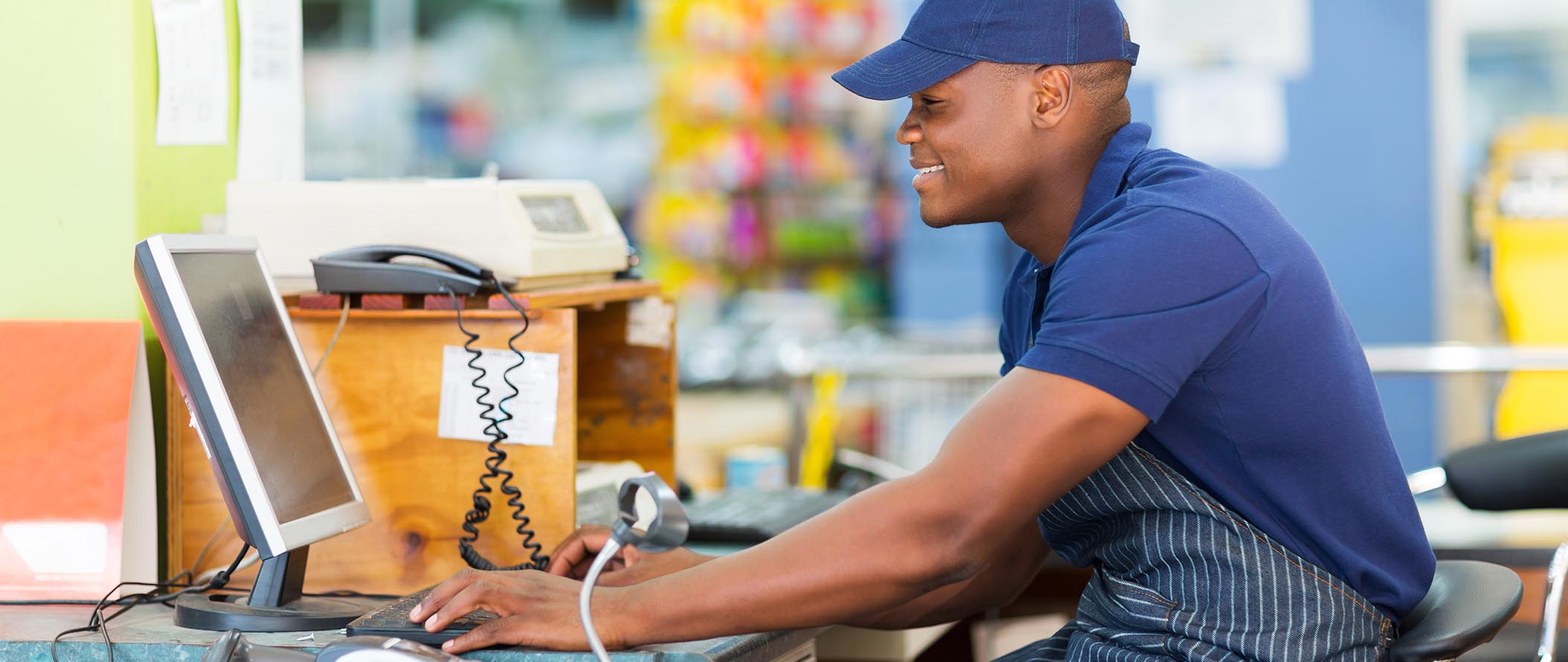 ret-male-cashier-working-at-store-banner.jpg