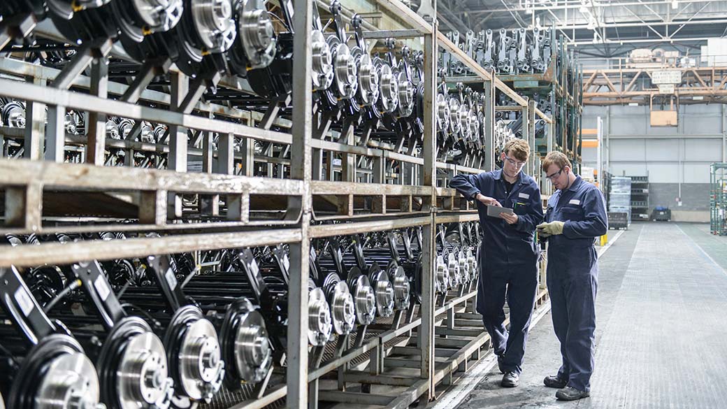 AUTO-Workers-Inspecting-Shelving-Unit-In-Car-Plant.jpg